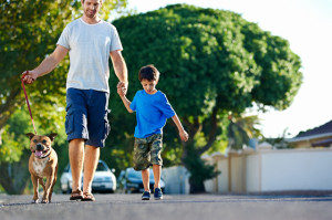 man-walking-child-and-dog-300x199